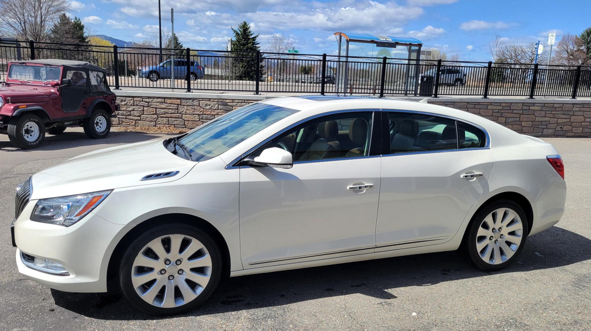 2014 Pearl White /Brown Buick LaCrosse PREMIUM (1G4GE5G33EF) with an 3.6L V6 engine, 6 Speed Auto transmission, located at 450 N Russell, Missoula, MT, 59801, (406) 543-6600, 46.874496, -114.017433 - Beautiful AWD Luxury Sedan. 3.6L V6 Engine. 6 Speed Automatic Transmission. Power Sunroof. Leather Heated Seats. Bluetooth. Memory Seats. Air. Cruise. Tilt. Power Windows and Locks. AM FM XM CD. Bose Sound. Remote Start. Adaptive Cruise Control. - Photo#3